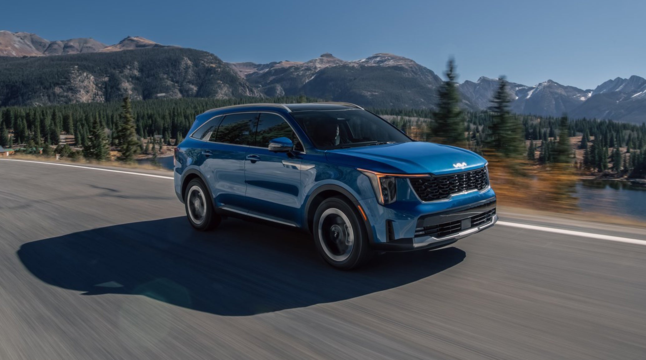 2025 Kia Sorento Hybrid with Mountains and Trees