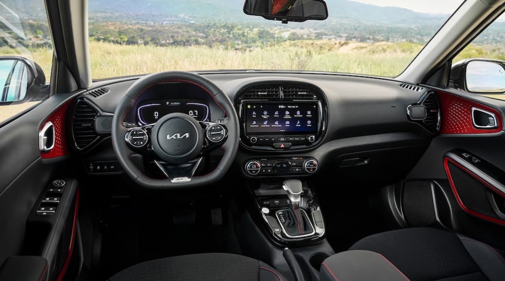 The steering wheel and dashboard of a 2025 Kia Soul SUV