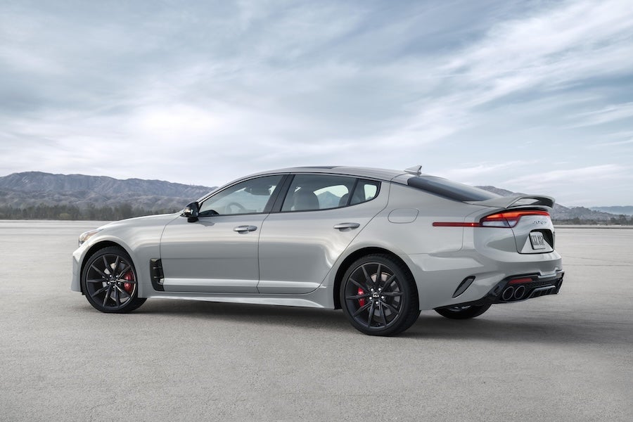 A silver 2022 Kia Stinger fastback parked in the desert